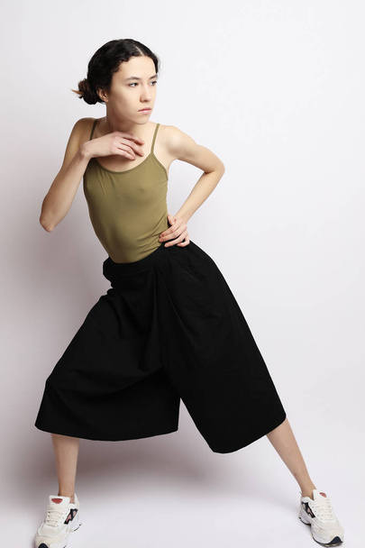lifestyle, fashion and people concept: Full body young fashion woman model posing in studio - 写真・画像