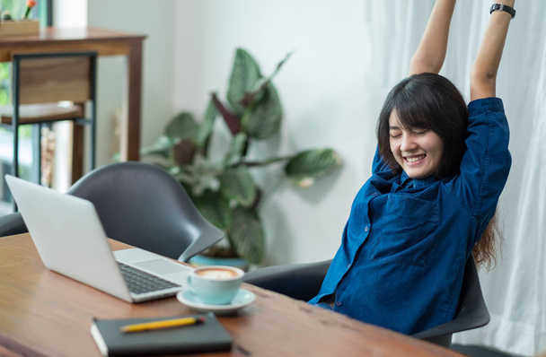 asia woman relax after working,female raise arm up stretching in - Photo, Image