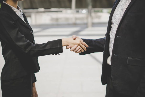Business people shaking hands, finishing up meeting deals. Business concept. - Fotografie, Obrázek
