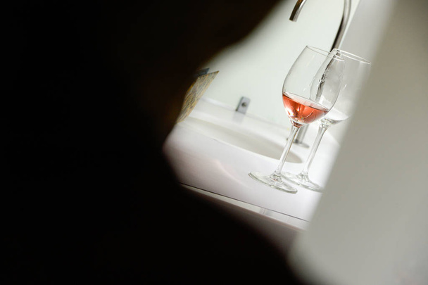 Tasting rose wine pour in a glass - Photo, image