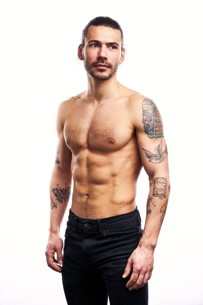 Handsome young shirtless tattooed man posing isolated on white background  - Photo, image