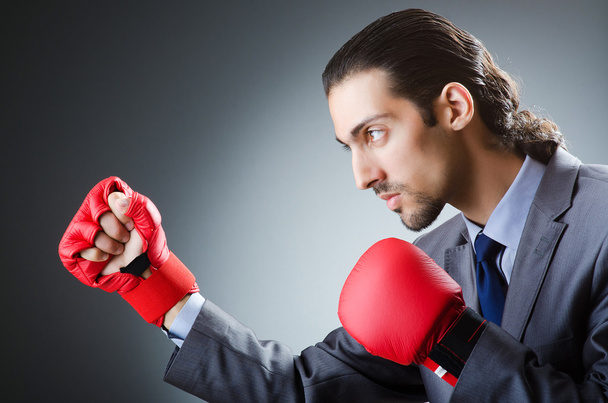Businessman with boxing gloves on white - Photo, Image