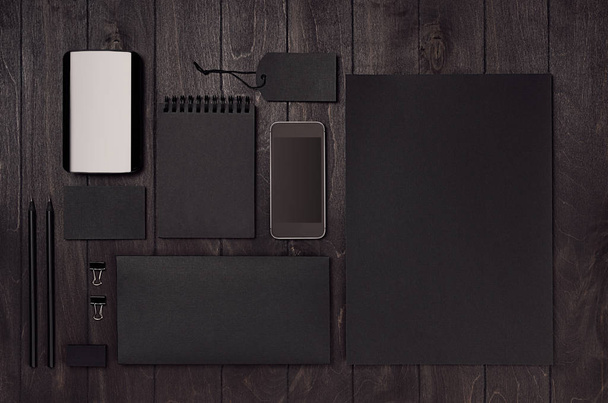 Black corporate stationery, branding mockup set with phone, coffee on dark wood board. Modern stylish male work place. - Valokuva, kuva