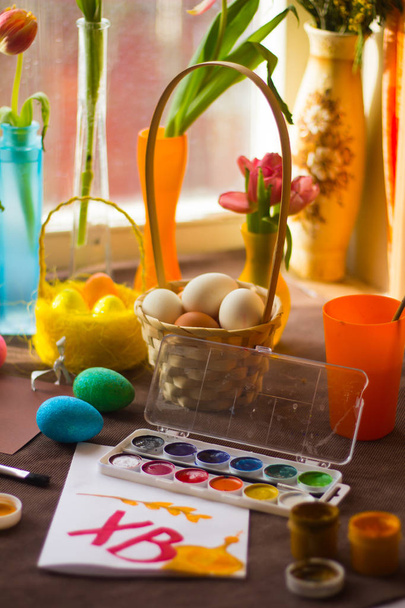 Painted Easter eggs and tulips in a vase - Photo, Image