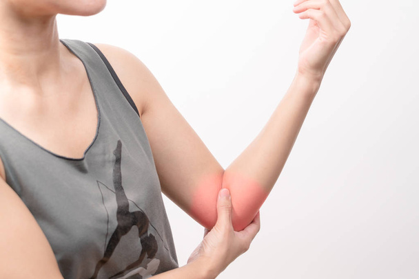 closeup women elbow pain/injury with red highlights on pain area with white backgrounds, healthcare and medical concept - Photo, Image