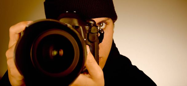 Paparazzi, Young and attractive man taking photographs with his dslr camera - Fotoğraf, Görsel