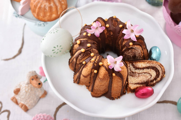closeup of easter traditional marble ring cake on festive table  - Фото, изображение