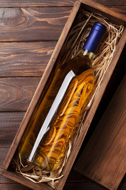 White wine bottle in box. Top view with space  - Zdjęcie, obraz
