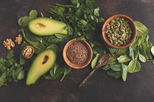 Green salad. Vegan ingredients: spinach, avocado, flax  - Photo, Image