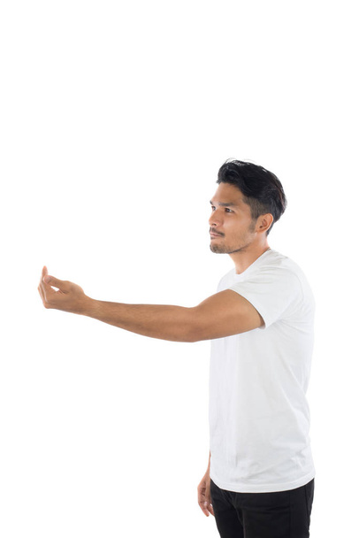 Mladý pohledný muž ukazovat prostředníček s izolované na bílém  - Fotografie, Obrázek