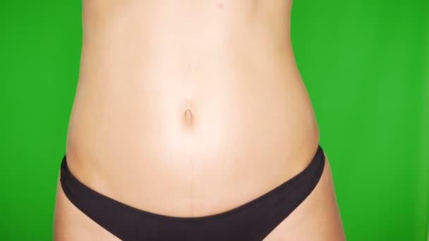 Closeup of sexy woman in panties on green background - Footage, Video
