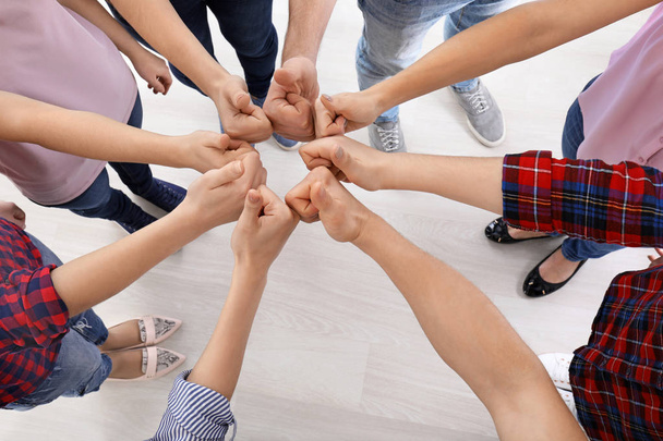 Group of people standing in circle and showing thumb-up gesture. Unity concept - Foto, immagini