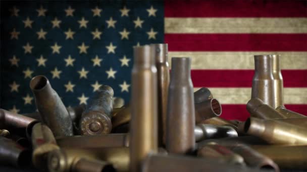munições colocadas em frente a uma bandeira americana
 - Filmagem, Vídeo