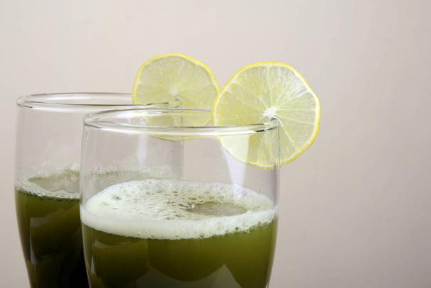 Close up of sugar cane juice with lemon slice - Photo, Image