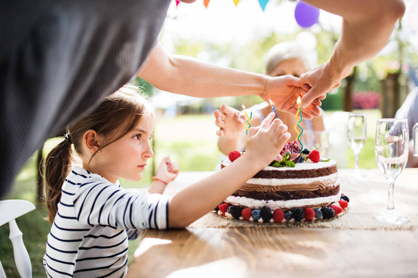 Family celebration or a garden party outside in the backyard. - Foto, afbeelding