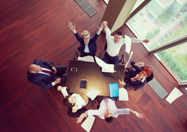 top view of  business people group on meeting throwing documents in air - Fotoğraf, Görsel