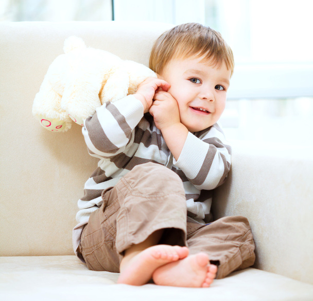 Portrait of a little boy with his teddy bear - Фото, зображення