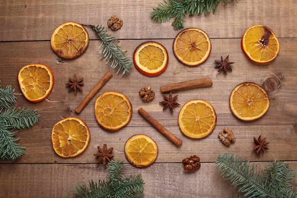Dry slices of oranges lying on the table. Decorative ornament. C - Foto, Imagem