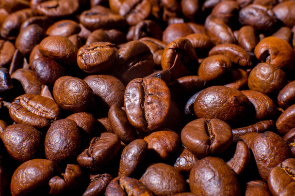 Roasted coffee beans close-up macro photo - Фото, зображення