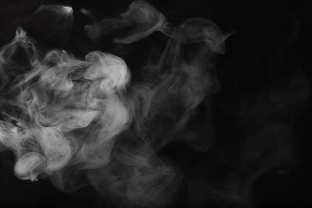 White smoke on a black background. Texture of smoke. Clubs of wh - Photo, Image