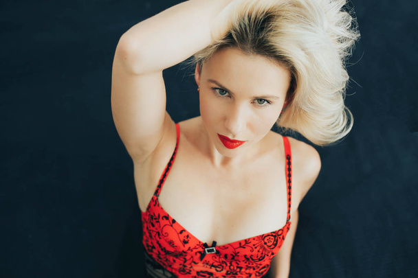 Beautiful Portrait blonde woman in a red lingerie - Фото, зображення