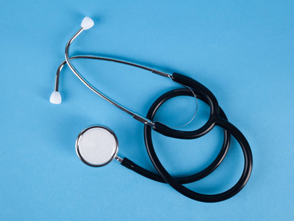 Stethoscope (phonendoscope) isolated on blue background, medical - 写真・画像