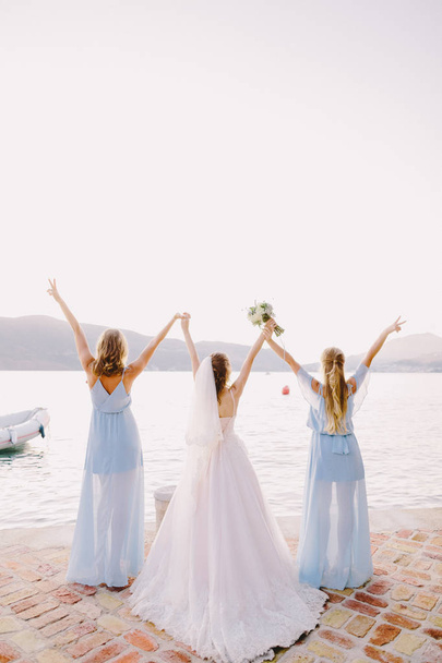 bridesmaids and bride on beach - Photo, Image