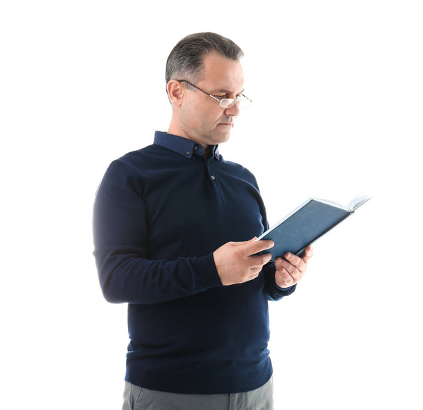 Portrait of male teacher with book on white background - Photo, Image