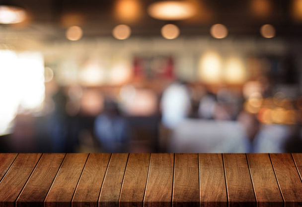 Wooden board empty table  cafe, coffee shop, bar blurred backgro - Foto, imagen