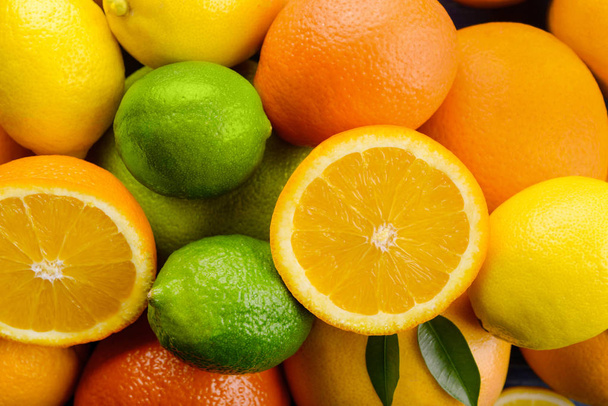 Ripe citrus fruits as background, closeup - Foto, afbeelding