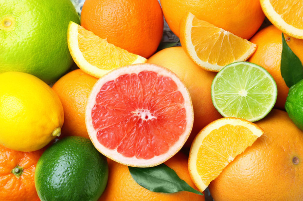 Rijp citrus fruit als achtergrond - Foto, afbeelding