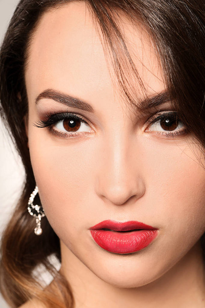 Portrait of young woman with beautiful professional makeup, closeup - Foto, Bild