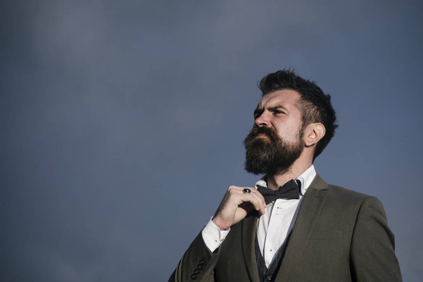 Man with beard and mustache with dramatic sky on background. - Фото, зображення