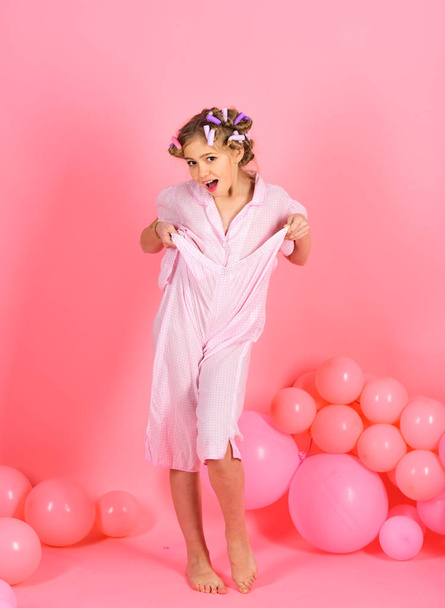 Funny little girl on background of bright pink wall - Photo, Image