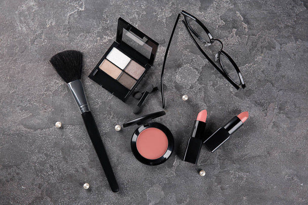 Flat lay composition with decorative cosmetics on gray background - Фото, зображення