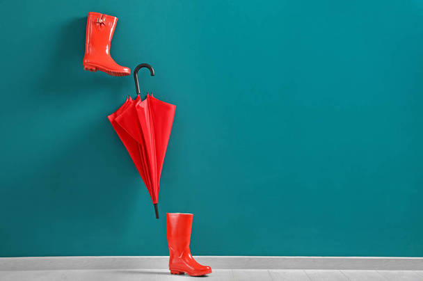 red umbrella and rubber boots - Φωτογραφία, εικόνα