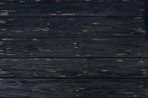 Black colored wooden texture background. - Foto, Imagen