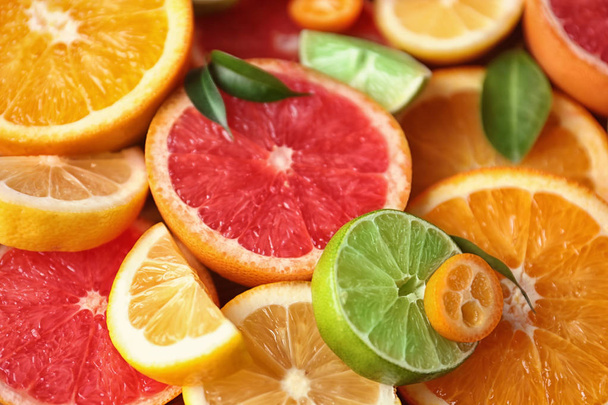 Slices of fresh citrus fruits, closeup - Φωτογραφία, εικόνα
