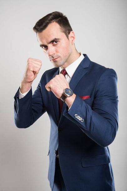 Attractive business man holding fists like fighting - Photo, Image