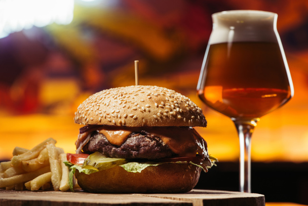 tasty beef burger with french fries and glass of beer  - Photo, Image