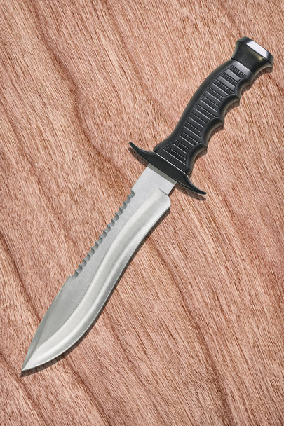 Fixed Blade Tactical Combat Hunting Survival Sawback Bowie Knife Set On Cherry Wood Veneer Backdrop - Photo, Image