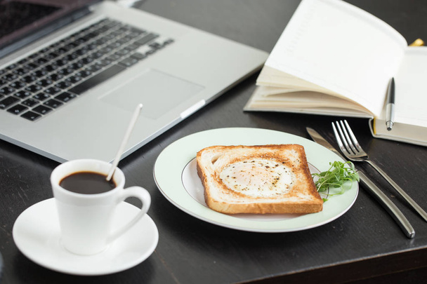Business breakfast. Egg fried in toast with coffee - Фото, зображення