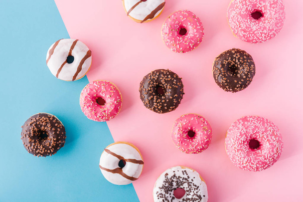 Abstract donuts on multicolored background - 写真・画像