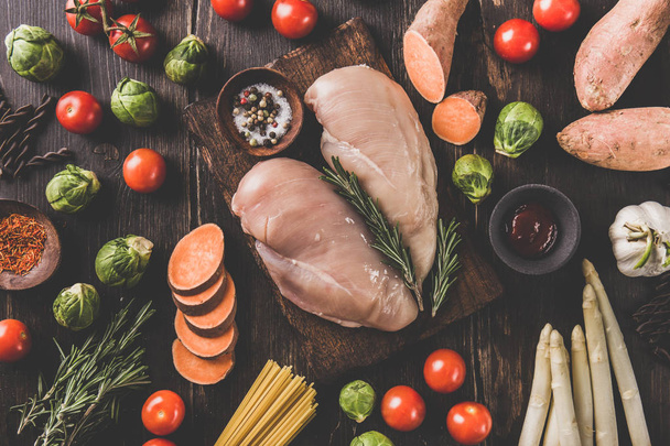 Raw chicken breasts and vegetables - Photo, image