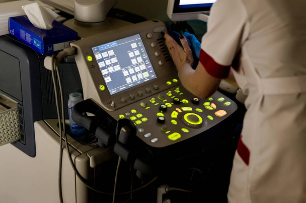 Close-up of ultrasound machine in clinic. Modern hospital with high technology equipment. Health care, diagnostic and disease prevention concept  - Photo, Image