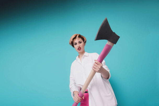 Angry furious businesswoman girl with an ax, screaming. Negative human emotions, facial expressions, feelings, aggression, anger management issues concept - Photo, Image