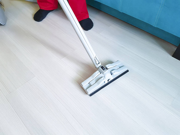 men vacuum the floor with steam - 写真・画像