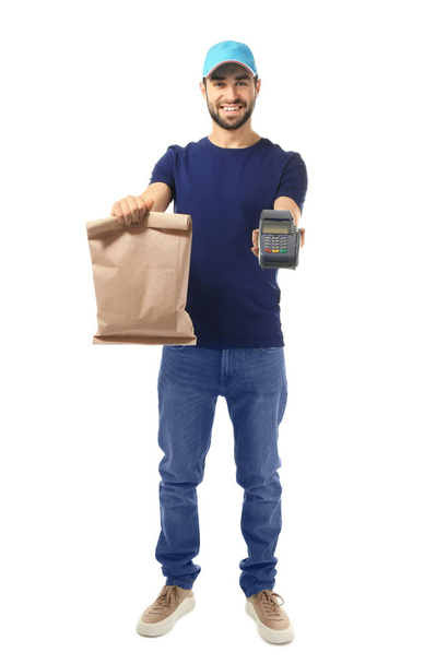 Delivery man holding paper bag with food and payment terminal on white background - Zdjęcie, obraz