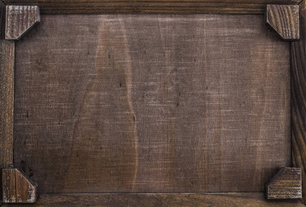 Empty brown wooden  serving tray on the black wooden table backgroun - Valokuva, kuva