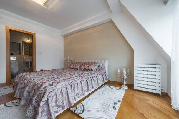 Interior of a luxury loft bedroom with master bed and bathroom - Foto, Bild